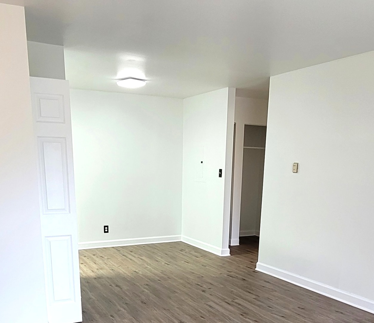 2700 Light Road, Unit 110 Oswego, IL 60543 - Photo 11 of 12 a view of a room with wooden floor