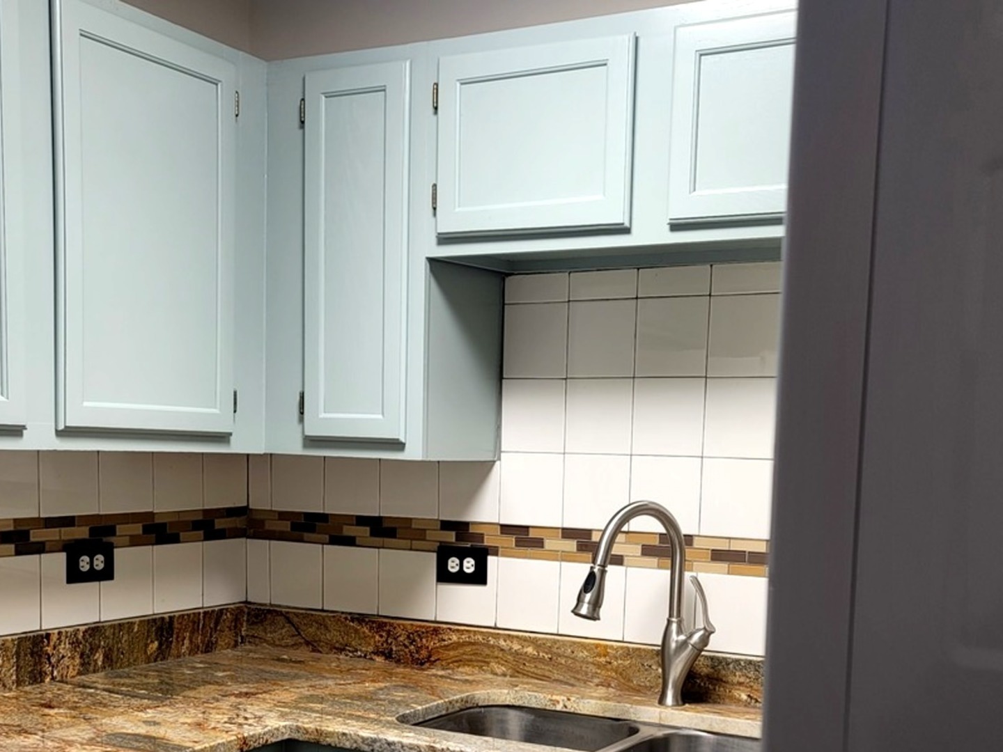 2700 Light Road, Unit 110 Oswego, IL 60543 - Photo 3 of 12 a kitchen with granite countertop white cabinets and window