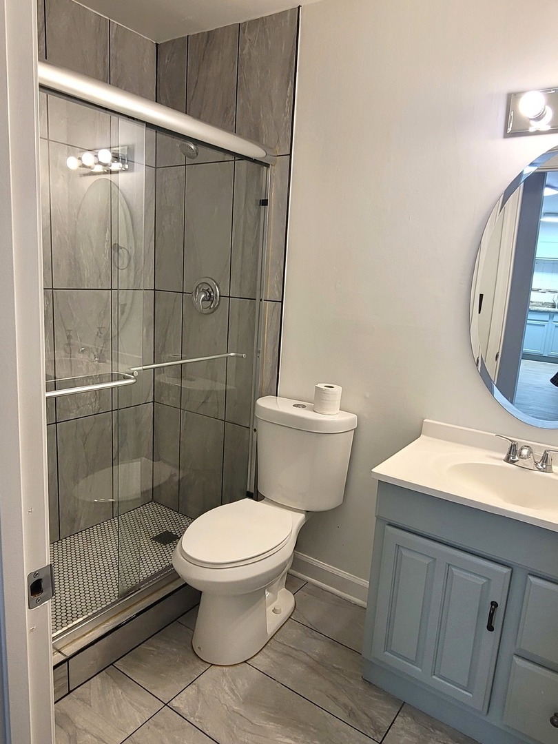 2700 Light Road, Unit 110 Oswego, IL 60543 - Photo 5 of 12 a bathroom with a sink toilet and shower