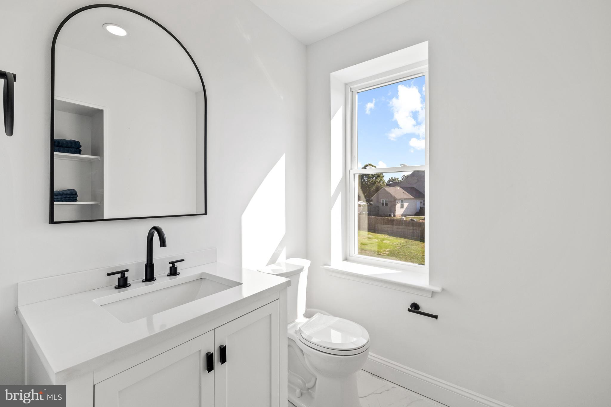 2055 Allentown Road Hatfield, PA 19440 - Photo 24 of 43 a bathroom with a toilet sink and mirror