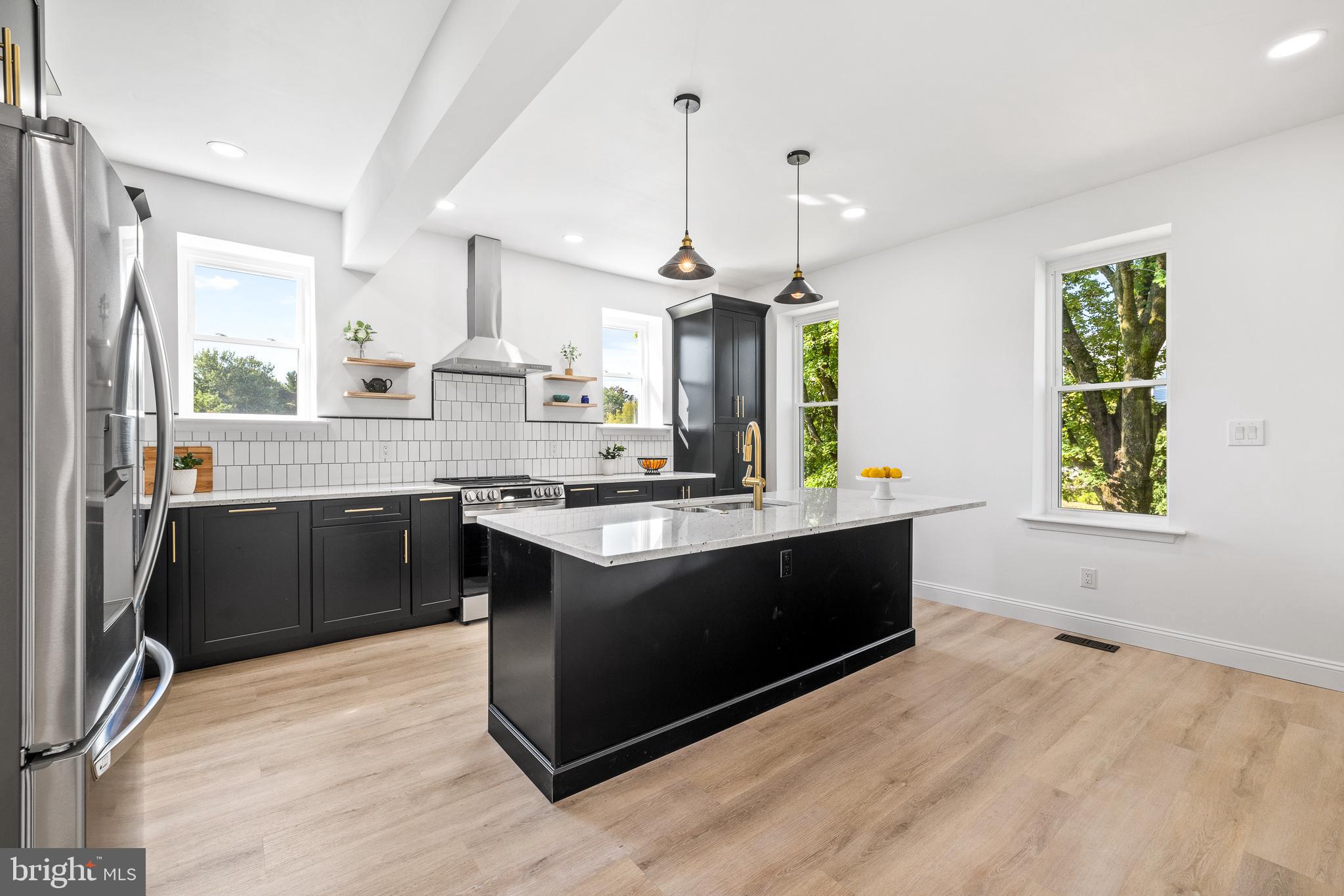 2055 Allentown Road Hatfield, PA 19440 - Photo 4 of 43 a large kitchen with kitchen island a sink stainless steel appliances and cabinets