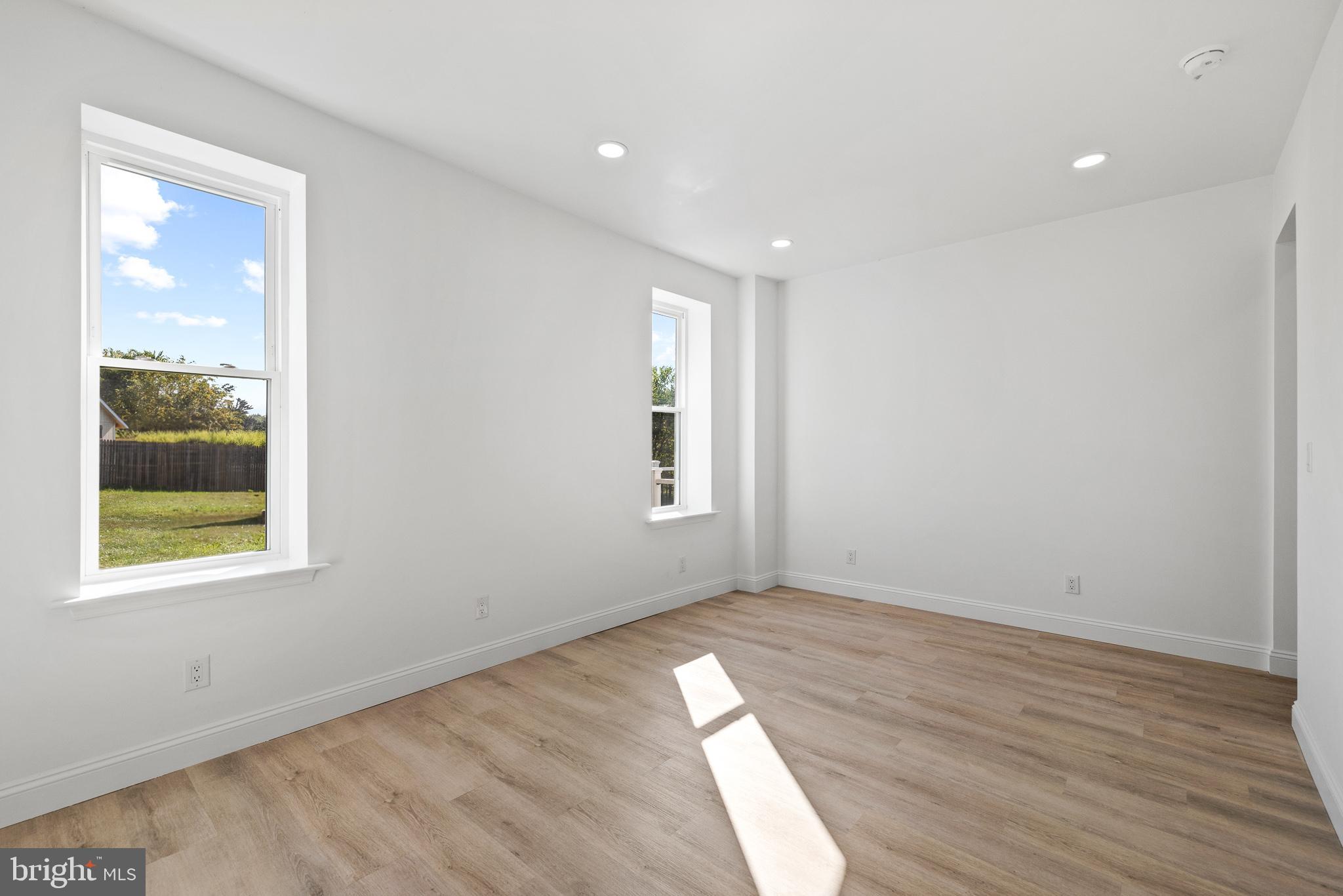 2055 Allentown Road Hatfield, PA 19440 - Photo 10 of 43 a view of an empty room with wooden floor and a window