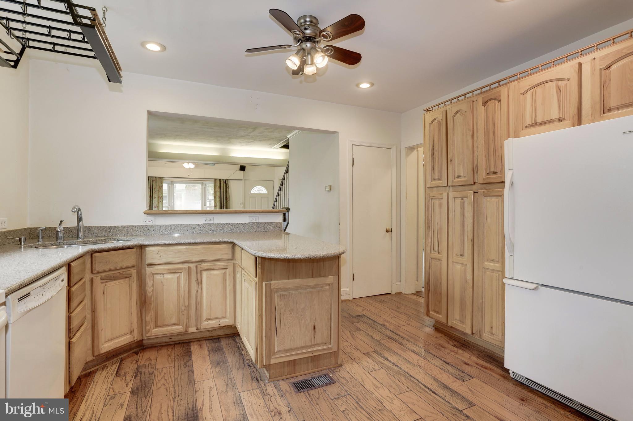 1908 Ridgeville Road Edgewater, MD 21037 - Photo 14 of 30 a spacious bathroom with a granite countertop sink a toilet a mirror and shower