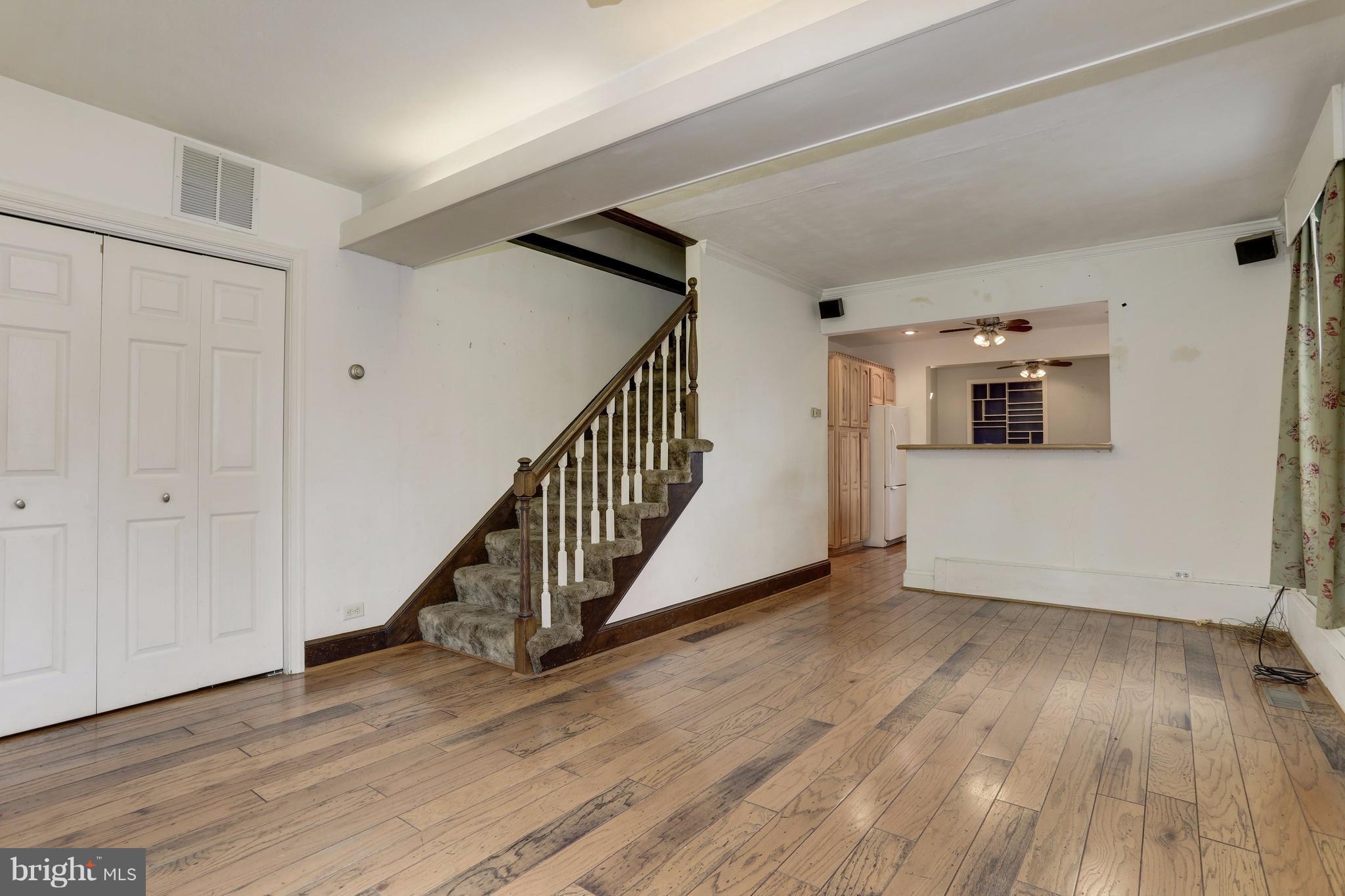 1908 Ridgeville Road Edgewater, MD 21037 - Photo 8 of 30 a view of a hallway with wooden floor and stairs