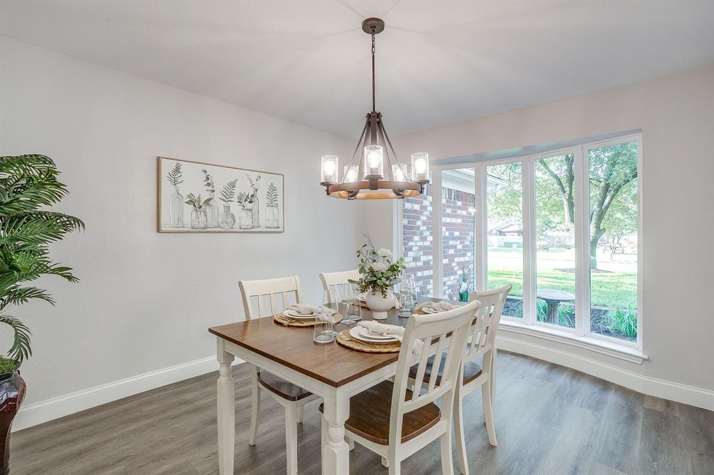1003 Canton Road Cleburne, TX 76033 - Photo 11 of 40 a view of a dining room with furniture window and wooden floor