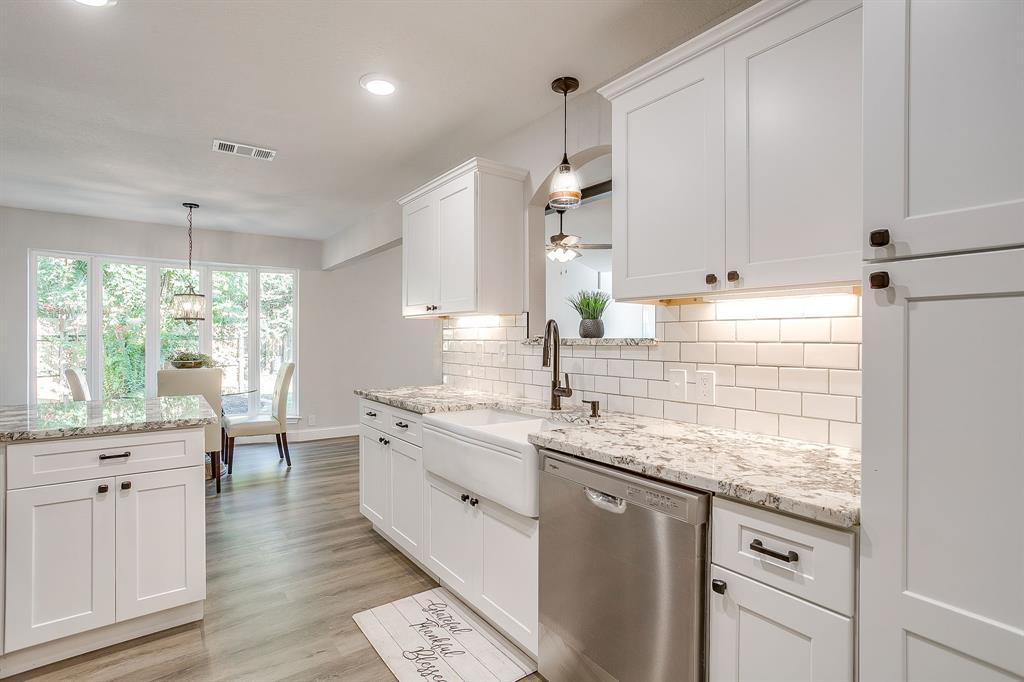 1003 Canton Road Cleburne, TX 76033 - Photo 12 of 40 a kitchen with a sink stove and cabinets