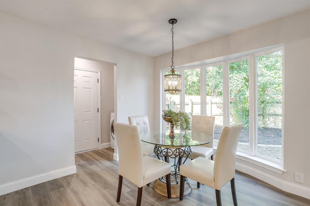 1003 Canton Road Cleburne, TX 76033 - Photo 17 of 40 a view of a dining room with furniture window and wooden floor
