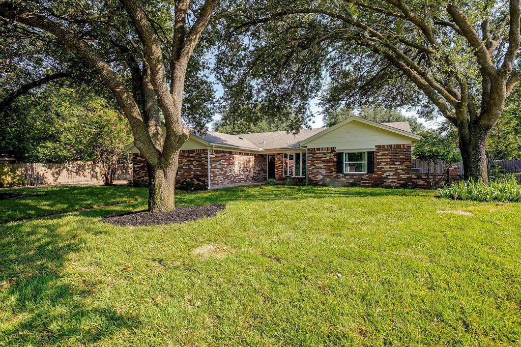 1003 Canton Road Cleburne, TX 76033 - Photo 2 of 40 a front view of a house with garden
