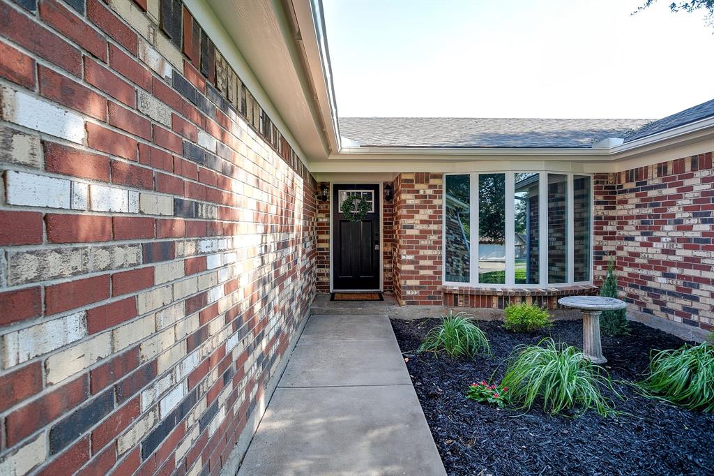 1003 Canton Road Cleburne, TX 76033 - Photo 3 of 40 a entryway with a garden