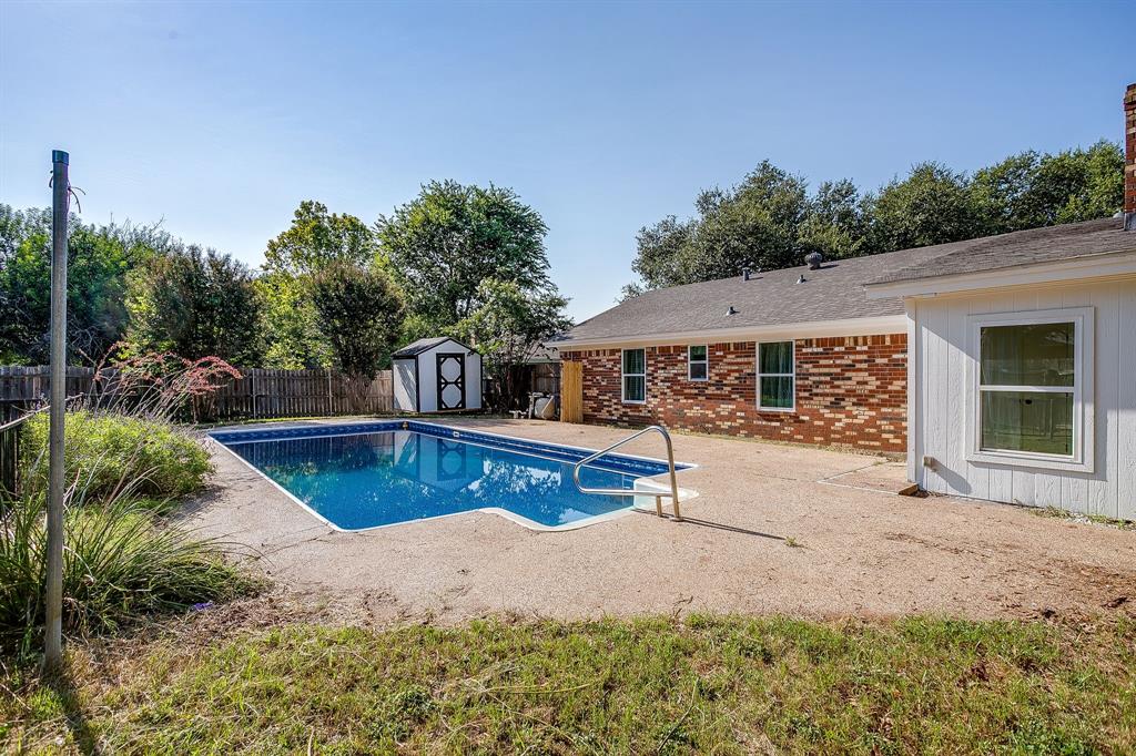 1003 Canton Road Cleburne, TX 76033 - Photo 33 of 40 a front view of a house with a yard