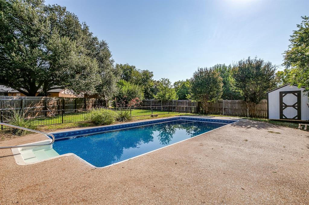 1003 Canton Road Cleburne, TX 76033 - Photo 34 of 40 a view of swimming pool with a yard