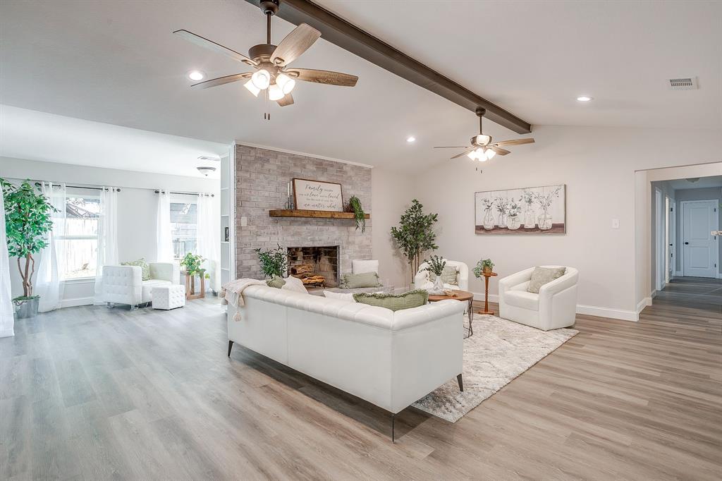 1003 Canton Road Cleburne, TX 76033 - Photo 6 of 40 a living room with furniture and a fireplace
