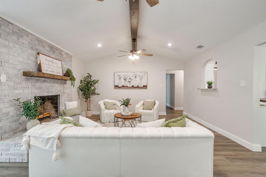 1003 Canton Road Cleburne, TX 76033 - Photo 7 of 40 a living room with furniture and a fireplace