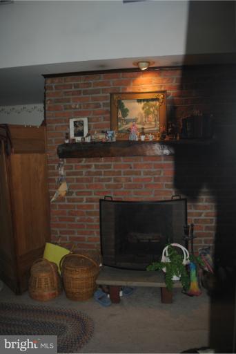 308 Fey Road Chestertown, MD 21620 - Photo 18 of 29 Brick fireplace in master bedroom