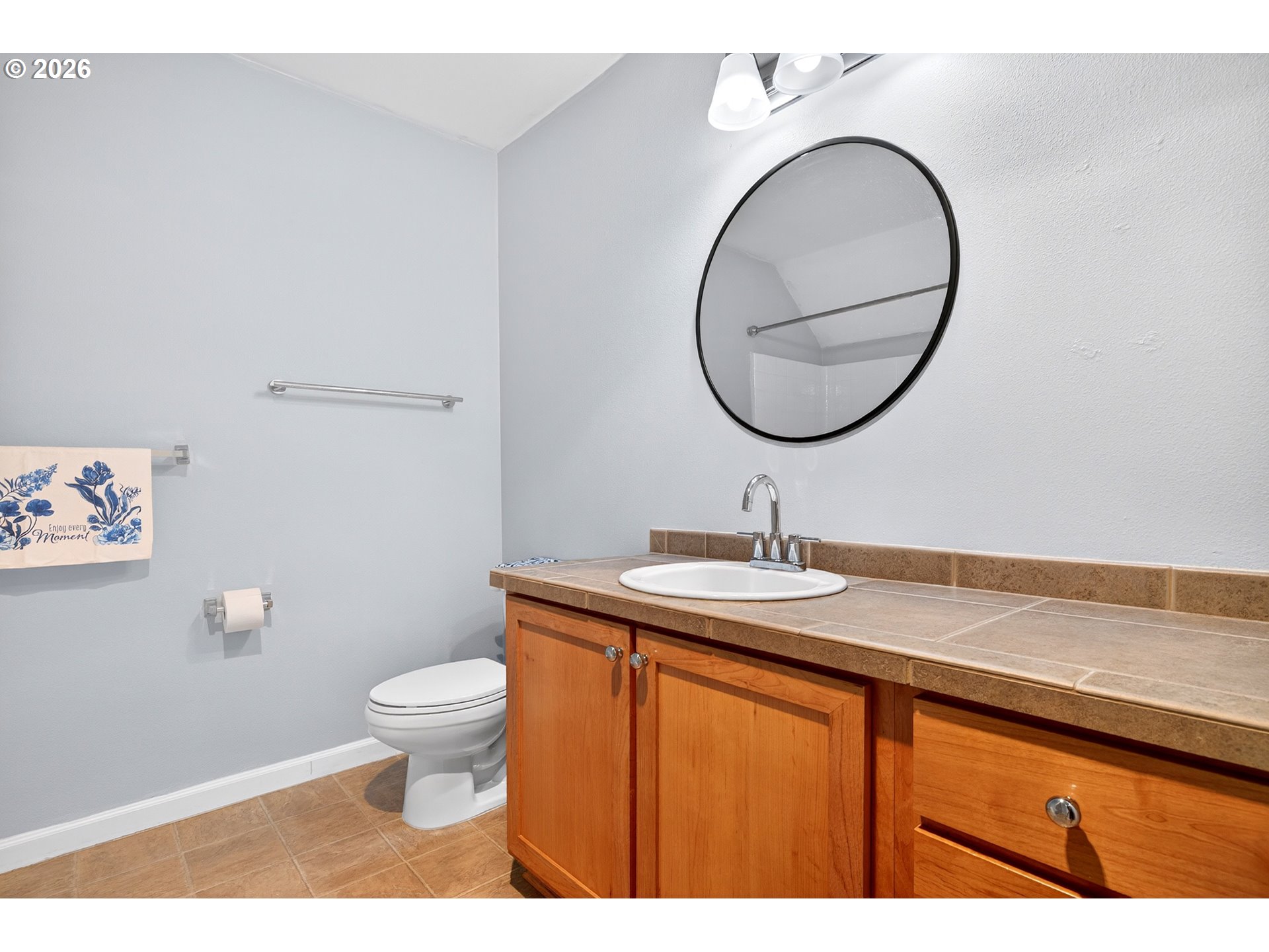102 Northeast Canvasback Way Hillsboro, OR 97006 - Photo 20 of 36 a bathroom with a granite countertop sink and a mirror