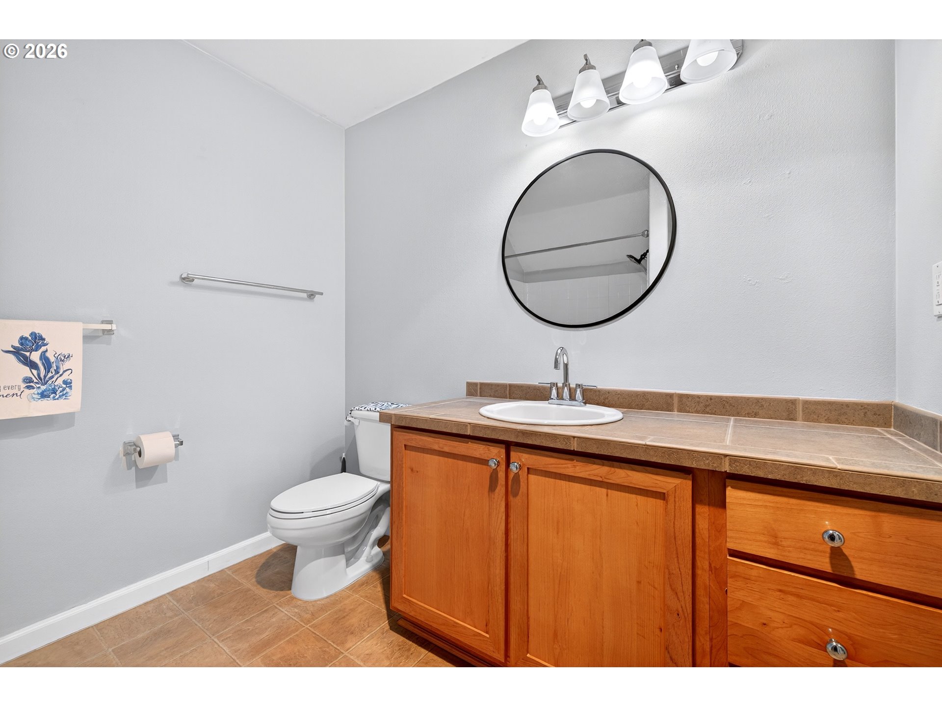 102 Northeast Canvasback Way Hillsboro, OR 97006 - Photo 25 of 36 a bathroom with a toilet sink and mirror
