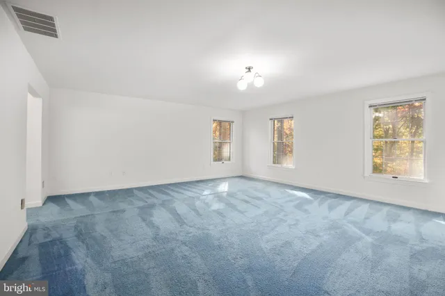 a view of an empty room with stairs