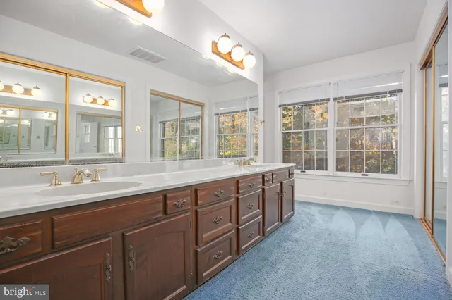 an empty room with a empty space and windows