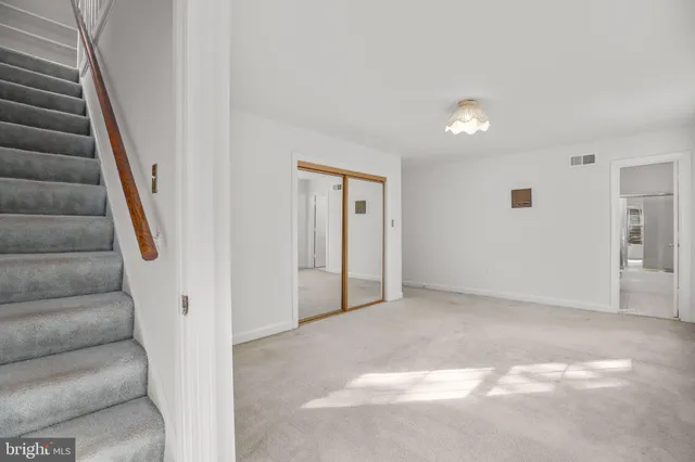 a picture of a bench in a white building