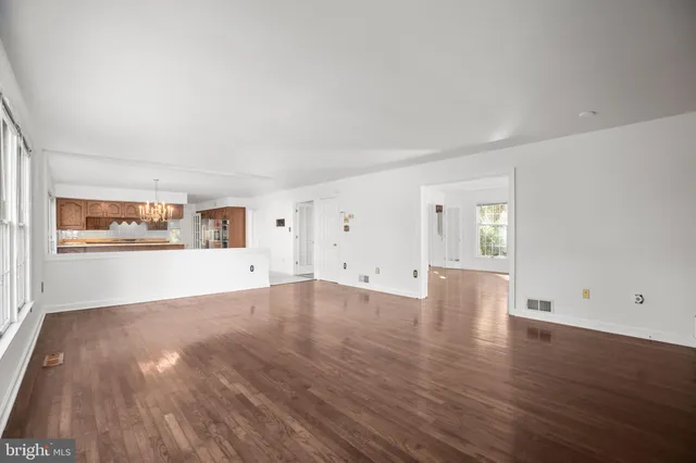 a kitchen with a stove a sink a microwave a center island and a cabinets