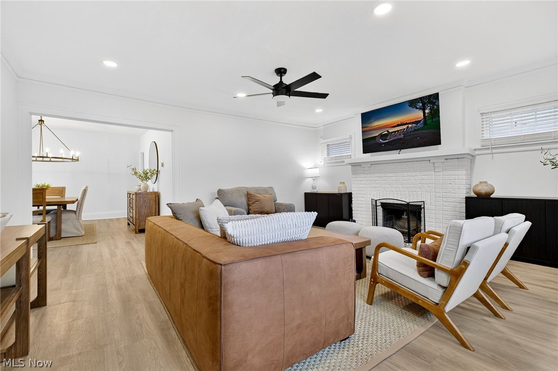 3326 East Overlook Road Cleveland Heights, OH 44118 - Photo 6 of 29 Bright living space featuring wood-finish flooring, recessed lighting, and a white brick fireplace