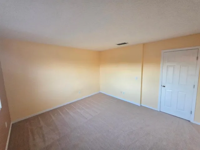 a view of a ceiling fan and entryway