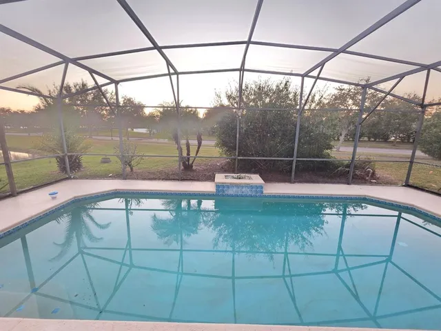a kitchen with stainless steel appliances a refrigerator and a stove top oven