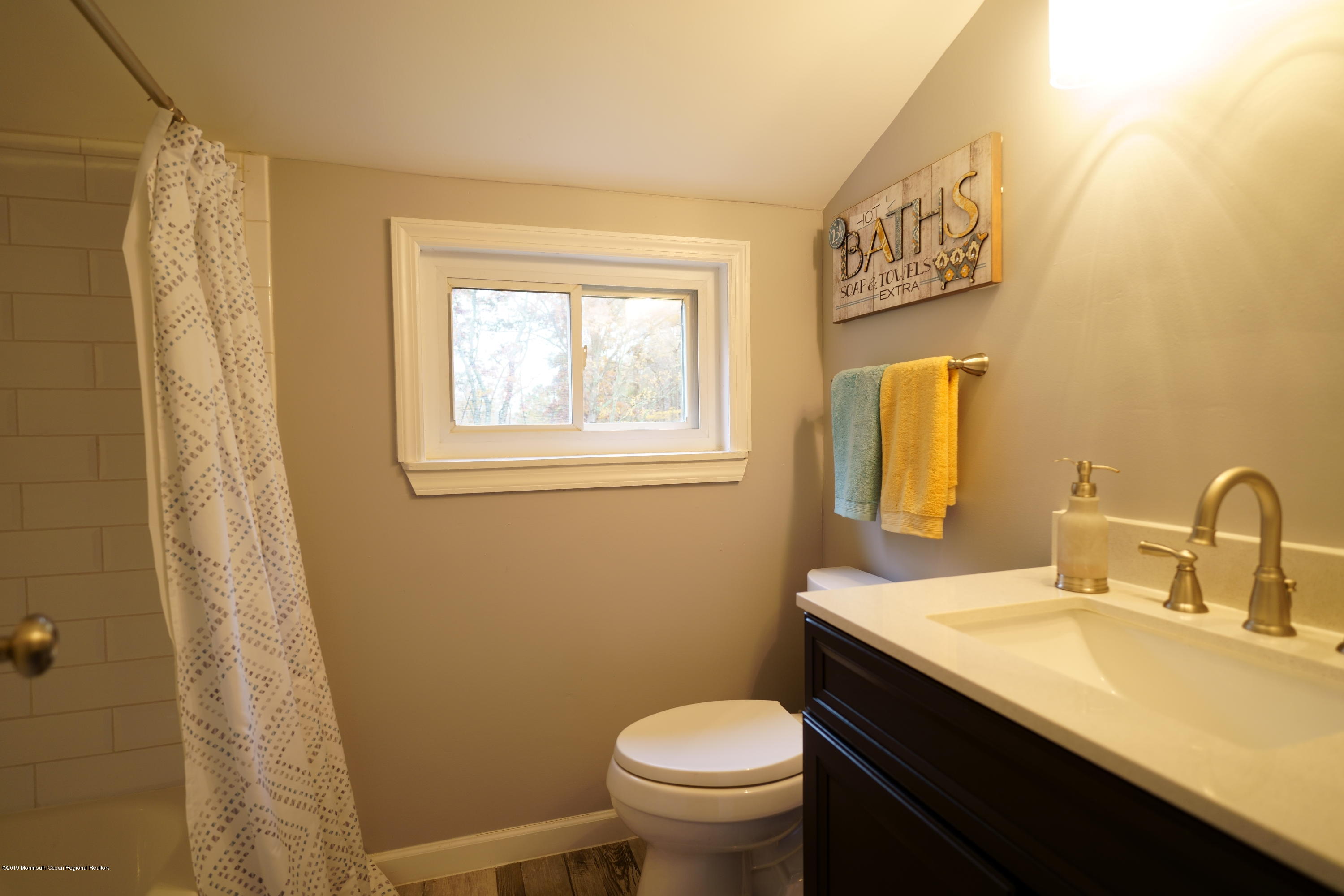 63 Darien Road Howell, NJ 07731 - Photo 11 of 21 a bathroom with a sink a toilet and a mirror