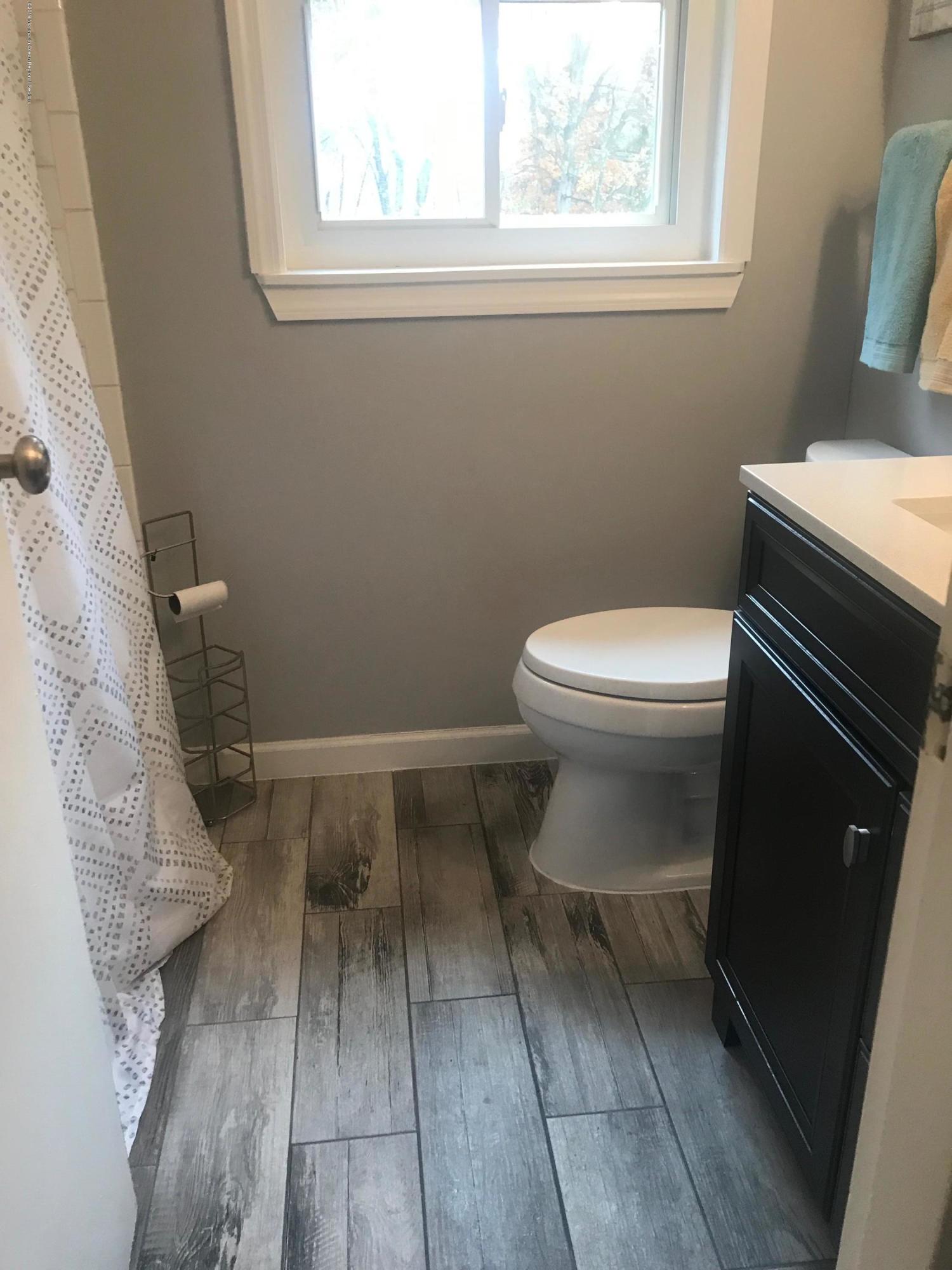 63 Darien Road Howell, NJ 07731 - Photo 12 of 21 a bathroom with a toilet and a vanity