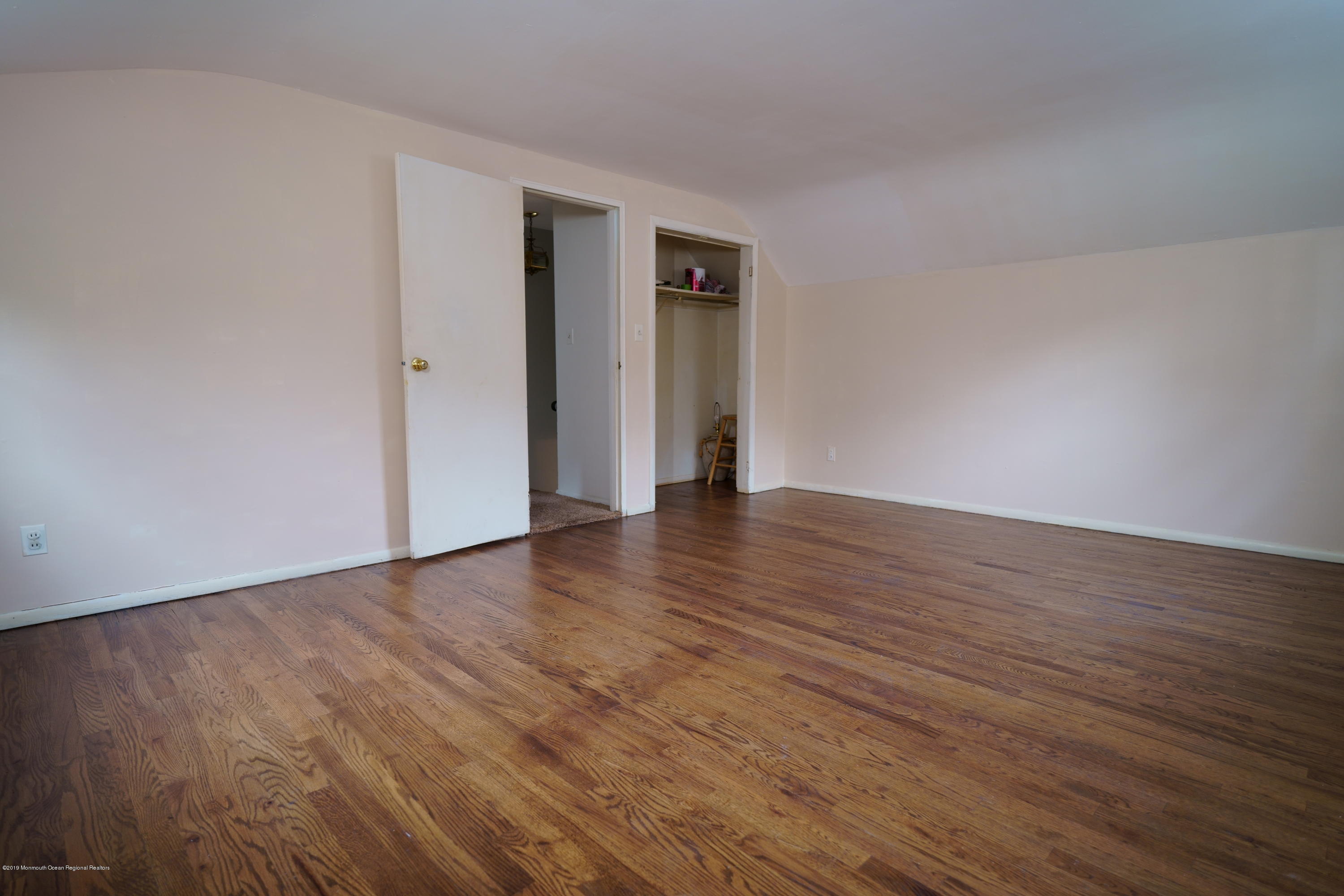 63 Darien Road Howell, NJ 07731 - Photo 14 of 21 a view of an empty room with wooden floor and closet