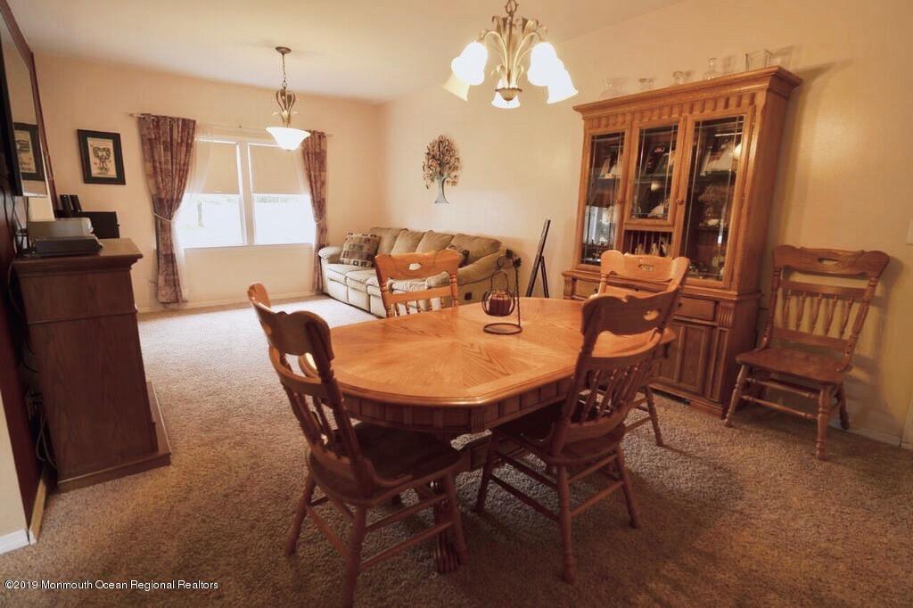 63 Darien Road Howell, NJ 07731 - Photo 6 of 21 a view of a dining room with furniture window and outside view