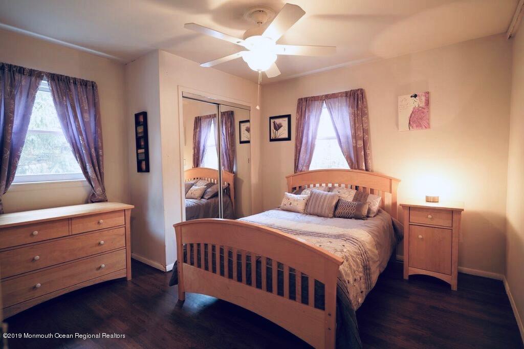 63 Darien Road Howell, NJ 07731 - Photo 8 of 21 a bedroom with a bed and wooden floor