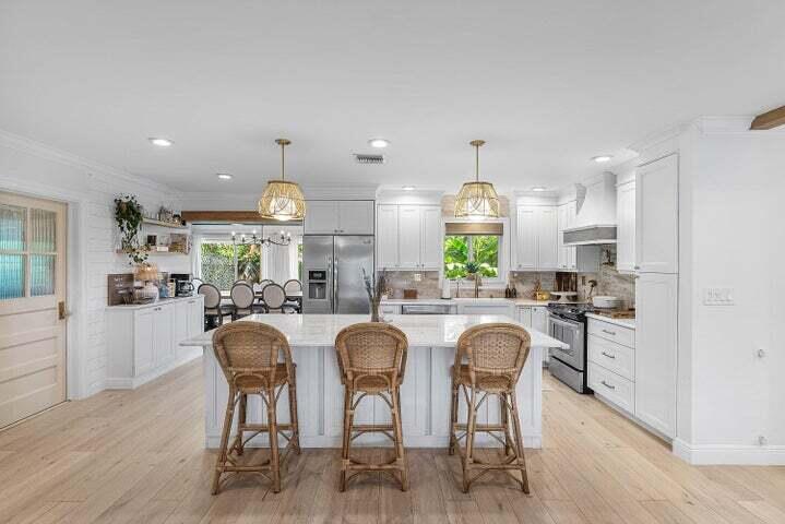 499 Northeast 28th Road Boca Raton, FL 33431 - Photo 12 of 52 a large kitchen with a table and chairs