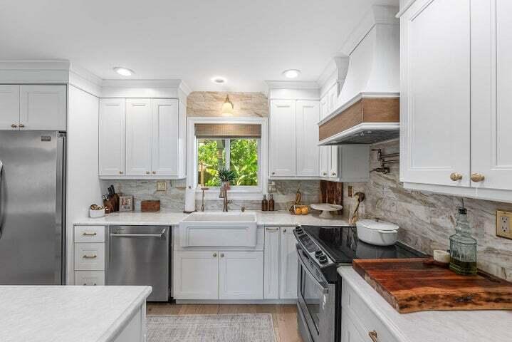 499 Northeast 28th Road Boca Raton, FL 33431 - Photo 15 of 52 a kitchen with a sink stove and refrigerator