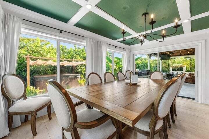 499 Northeast 28th Road Boca Raton, FL 33431 - Photo 18 of 52 a dining room with furniture a chandelier and wooden floor