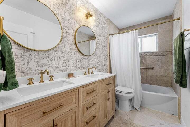 499 Northeast 28th Road Boca Raton, FL 33431 - Photo 21 of 52 a bathroom with a sink a toilet and a mirror