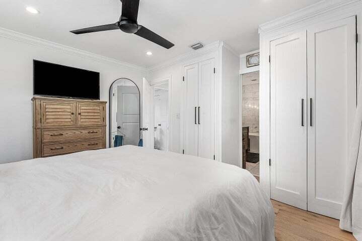 499 Northeast 28th Road Boca Raton, FL 33431 - Photo 27 of 52 a bedroom with a bed and a flat screen tv