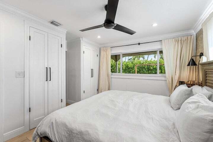 499 Northeast 28th Road Boca Raton, FL 33431 - Photo 28 of 52 a bedroom with a large bed and a window