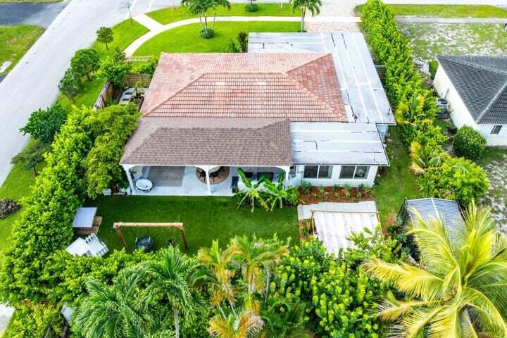 499 Northeast 28th Road Boca Raton, FL 33431 - Photo 44 of 52 a aerial view of a house with a yard and potted plants