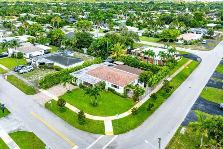 499 Northeast 28th Road Boca Raton, FL 33431 - Photo 49 of 52 a view of a garden with a swimming pool