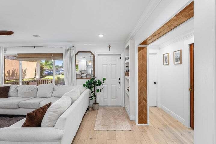 499 Northeast 28th Road Boca Raton, FL 33431 - Photo 6 of 52 a living room with furniture and wooden floor