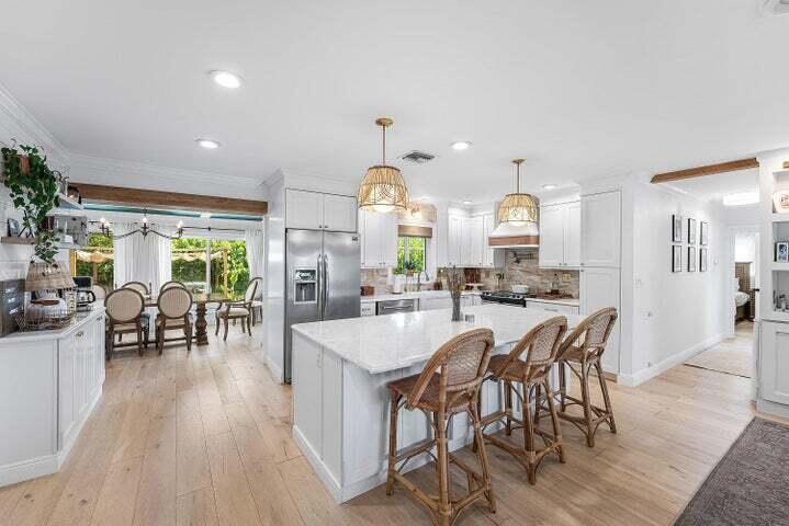 499 Northeast 28th Road Boca Raton, FL 33431 - Photo 10 of 52 a large kitchen with a table and chairs