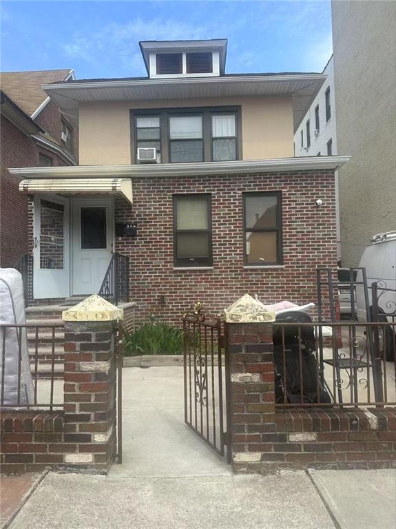 a front view of a house with glass windows