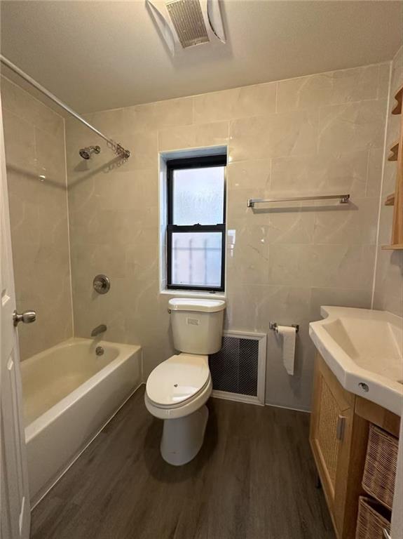 2121 84th Street Brooklyn, NY 11214 - Photo 7 of 8 a bathroom with a sink toilet a mirror and shower
