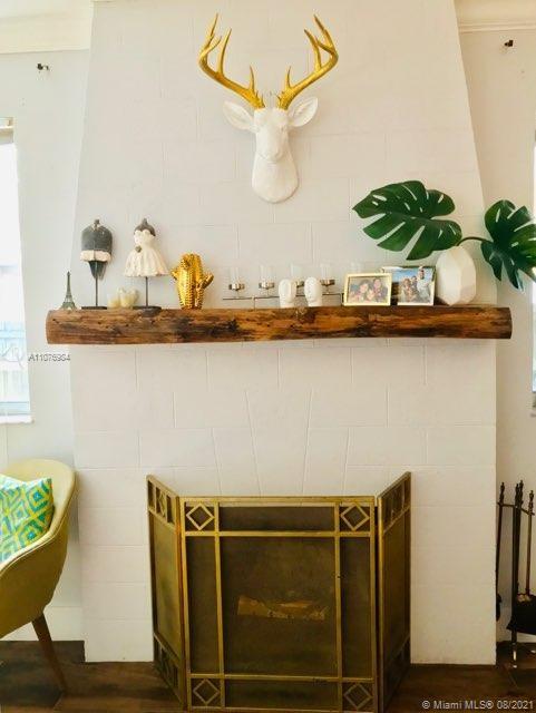 5648 Southwest 5th Terrace Miami, FL 33134 - Photo 5 of 7 a view of a table and chair with wooden floor