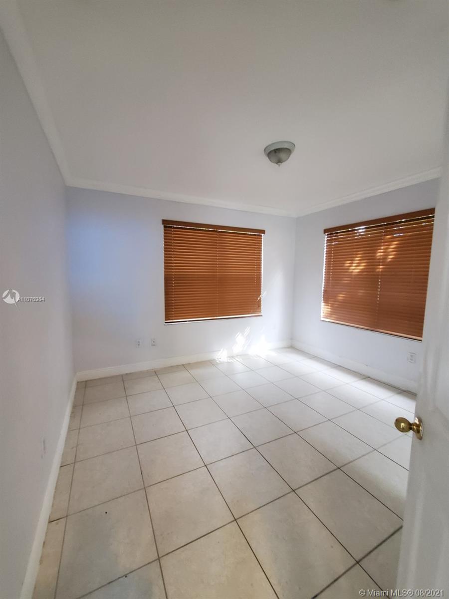 5648 Southwest 5th Terrace Miami, FL 33134 - Photo 6 of 7 a view of an empty room with windows