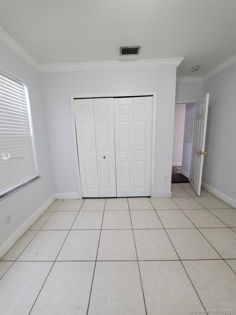 5648 Southwest 5th Terrace Miami, FL 33134 - Photo 7 of 7 a view of an empty room with a window
