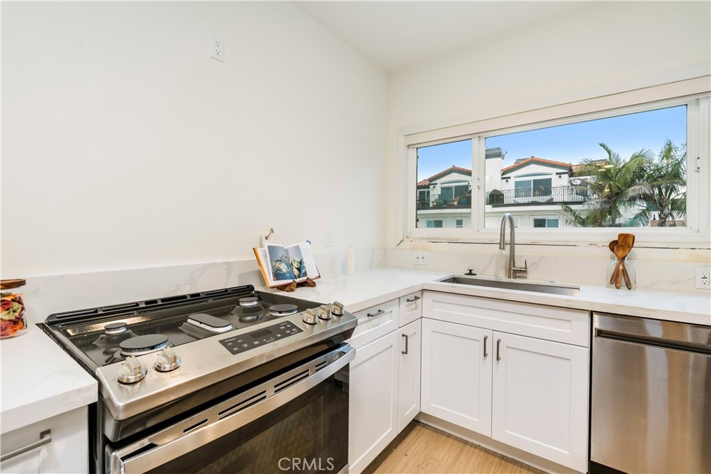150 10th Street Hermosa Beach, CA 90254 - Photo 15 of 19 a kitchen with a stove and a sink