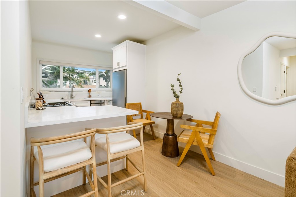 150 10th Street Hermosa Beach, CA 90254 - Photo 17 of 19 a view of a dining room with furniture and a large window