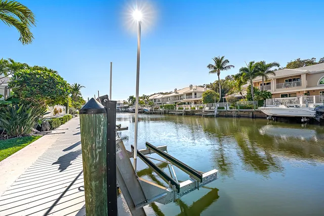 a view of a lake with a house in the background